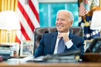 President Joe Biden talks on the phone with Tennessee Governor Bill Lee, R-Tenn., Tuesday, Aug. 24, 2021, in the Oval Office of the White House. (Official White House Photo by Adam Schultz). Original public domain image from Flickr