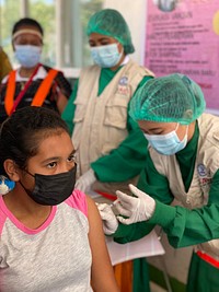 COVID-19 vaccination at a health center in Kupang. Photo: Swiny Andina, USAID. Original public domain image from Flickr