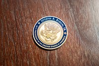 A September 11 commemorative Challenge Coin is seen Friday, September 10, 2021, in the Oval Office of the White House. (Official White House Photo by Adam Schultz)