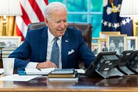 President Joe Biden talks on the phone with French President Emmanuel Macron, Wednesday, September 22, 2021, in the Oval Office. (Official White House Photo by Adam Schultz)