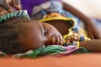 Child receiving treatment for severe malaria at Bogo District Hospital, 23rd September 2021.  Original public domain image from Flickr