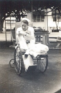 Naval Hospital Canacao, Philippine Islands, 1941. Dooley. [uninjured Hospital Corpsman? Sitting in a wheelchair] 