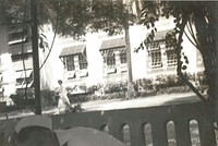 Naval Hospital Canacao, Philippine Islands, 1941. Miss Smith [Nurse walking down street].Naval Hospital Canacao, Philippine Islands, 1941. Miss Smith [Nurse walking down street].
