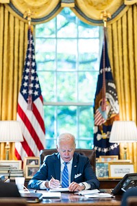 President Joe Biden reviews remark he will give on the 10th Anniversary of the Dr. Martin Luther King Jr. Memorial, Thursday, October 21, 2021, in the Oval Office. (Official White House Photo by Adam Schultz)