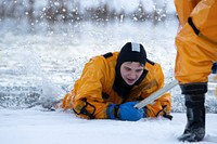 JBER fire protection specialists conduct ice rescue training. Original public domain image from Flickr