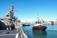 NAVAL STATION ROTA, Spain (Jan. 9, 2022) Tug boats pull away from the Arleigh Burke-class guided-missile destroyer USS Ross (DDG 71) after bringing the ship into port at Naval Station Rota, Spain, Jan. 9, 2022. Ross, forward-deployed to Rota, Spain, is on its 12th patrol in the U.S. Sixth Fleet area of operations in support of regional allies and partners and U.S. national security interests in Europe and Africa. (U.S. Navy photo by Mass Communication Specialist 2nd Class Claire DuBois/Released)