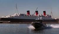 A U.S. Customs and Border Protection, Air and Marine Operations 41-foot Coastal Interceptor SAFE Boat patrols the Port of Long Beach, Calif., Feb. 7, 2022. Pictured in background is the historic ship The Queen Mary. CBP Photo by Glenn Fawcett