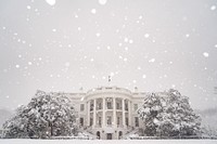 Snow falls at the White House.