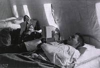 U.S. American National Red Cross Hospital No. 5, Auteuil, France: Wounded soldiers resting and reading in one of the wardsFormat: Still image  Extent: 1 photoprint. NLM Unique ID: 101404844 NLM Image ID: A011610 Permanent Link: resource.nlm.nih.gov/101404844