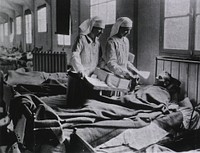 U.S. American National Red Cross Evacuation Hospital No. 114, Fleury-sur-Aisne, France: Ward M, nurses cheering up the patientsCollection: Images from the History of Medicine (IHM) Format: Still image Extent: 1 photoprint. NLM Unique ID: 101405077 NLM Image ID: A011751 Permanent Link: resource.nlm.nih.gov/101405077