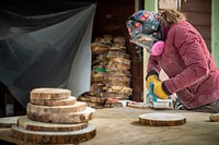 Tree "Cookies" are used to study climate changes over time.This image shows a person sanding a tree cookie outside a garage. One way of studying past climates is by looking at the growth rings on trees. Climatic conditions can be inferred by variations in the tree's rings. Widely spaced rings, from when the tree was growing fast, can mean the climate was favorable. Tightly spaced rings can show how a tree grew more slowly. The rings can also indicate avalanche patterns and so much more. United States Geological Survey (USGS) staff collect these tree "cookies" in Glacier National Park, and around the country. Then the cookies must be sanded so the rings can be easily seen and measured. You can learn more about this research here: www.nps.gov/articles/avalanche_research.htm