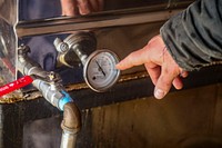 The process of making homemade maple syrup by tapping Maple trees directly.