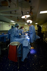 US Navy Sailors conduct a simulated mass casualty drill in response to a helicopter raid training exercise 210618-M-TS451-1421U.S. Navy sailors with America Amphibious Ready Group, 31st Marine Expeditionary Unit (MEU), conduct a surgical walkthrough to treat a patient during a mass casualty drill to assess skills and coordination between integrated units aboard the amphibious assault ship USS America (LHA 6) in the Philippine Sea, June 18, 2021. Marines with Battalion Landing Team 3/5, 31st MEU, carried out a helicopter raid training exercise, where they sustained notional causalities who were then transported to USS America for treatment. The 31st MEU is operating aboard ships of the America Ready Group in the 7th fleet area of operations to enhance interoperability with allies and partners and serve as a ready response force to defend peace and stability in the Indo-Pacific region. (U.S. Marine Corps photo by Cpl. Karis Mattingly)