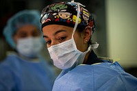 US Navy Sailors conduct a simulated mass casualty drill in response to a helicopter raid training exercise 210618-M-TS451-1304A U.S. Navy Lt. Cmdr. Marissa Mayor, a general surgeon with Fleet Surgical Team 7, observes her patient prior to conducting a surgical walkthrough during a mass casualty drill to assess skills and coordination between integrated units aboard the amphibious assault ship USS America (LHA 6) in the Philippine Sea, June 18, 2021. Marines with Battalion Landing Team 3/5, 31st MEU, carried out a helicopter raid training exercise, where they sustained notional causalities who were then transported to USS America for treatment. The 31st MEU is operating aboard ships of the America Ready Group in the 7th fleet area of operations to enhance interoperability with allies and partners and serve as a ready response force to defend peace and stability in the Indo-Pacific region. Mayor is a native of Mesa, Arizona. (U.S. Marine Corps photo by Cpl. Karis Mattingly)