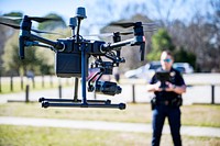 Greenville Police's Technology Officer A.F. Frasure demonstrates the department's DJI Matrice drone on Wednesday, March 2. Original public domain image from Flickr