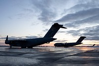 Air Force special warfare Airmen gear up for airborne operations at JBERAlaska Air National Guard C-17 Globemaster IIIs operated by Airmen from the 176th Wing are staged for airborne training at Joint Base Elmendorf-Richardson, Alaska, Feb. 22, 2022. The training demonstrated airborne and mission-readiness skills in Arctic conditions. (U.S. Air Force photo by Alejandro Peña)