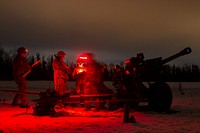 Spartan paratroopers conduct live-fire artillery trainingU.S. Army paratroopers assigned to Bravo Battery, 2nd Battalion, 377th Parachute Field Artillery Regiment, 4th Infantry Brigade Combat Team (Airborne), 25th Infantry Division, U.S. Army Alaska, operate the M119 105 mm howitzer during live-fire artillery training at Joint Base Elmendorf-Richardson, Alaska, March 16, 2022. The Soldiers of 4/25 belong to the only American airborne brigade in the Pacific and are trained to execute airborne maneuvers in extreme cold weather and high altitude environments in support of combat, partnership and disaster relief operations. (U.S. Air Force photo by Alejandro Peña)