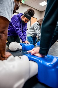 Students learning CPR at Greenville's Fire/Rescue training center at Station 6, date unknown. Original public domain image from Flickr