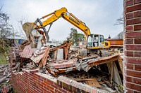 The City's Planning and Development Services Housing Division began demolishing a vacant house on Chestnut Street, March 23. Original public domain image from Flickr