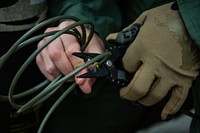 Cutting wires, security training. Original public domain image from Flickr