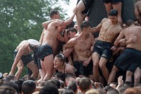 U.S. Naval Academy freshmen, plebes, climb the Herndon Monument, a tradition symbolizing the successful completion of the midshipmen's freshman year. (U.S. Navy photo by Stacy Godfrey/Released). May 22, 2021. Original public domain image from Flickr