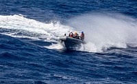 Sailors transit the Atlantic Ocean in a Rigid-Hull Inflatable Boat (RHIB) assigned to the Arleigh Burke-class guided-missile destroyer USS Paul Ignatius (DDG 117), June 5, 2021. (U.S. Navy photo by Mass Communication Specialist 2nd Class Nathan T. Beard/Released). Original public domain image from Flickr