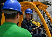 Cryptologic Technician 2nd Class, Megan Carmona, conducts forklift training aboard expeditionary Sea Base USS Hershel “Woody” Williams (ESB 4) in the Atlantic Ocean, June 08, 2021. (U.S. Navy photo by Mass Communication Specialist 2nd Class Eric Coffer/Released). Original public domain image from Flickr