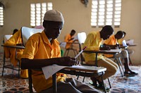 Boy student takes a national Primary Education Certificate exam in Mogadishu, Somalia, May 26, 2021. AMISOM Photo / Mokhtar Mohamed. Original public domain image from Flickr