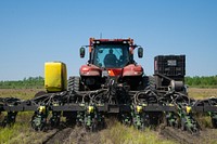 Tractor planting soybean seeds. Original public domain image from Flickr