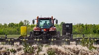 Alexander Frick, Jr. in his tractor, planter, planting soybean seeds with the aid of precision agriculture systems and information, April 13, 2021. Original public domain image from Flickr