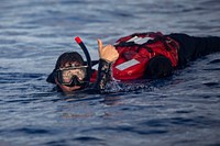 Boatswain’s Mate 3rd Class Brandon Langer assigned to the Arleigh Burke-class guided-missile destroyer USS Paul Ignatius (DDG 117), conducts search and recovery training during a man overboard drill in the Atlantic Ocean, June 12, 2021. (U.S. Navy photo by Mass Communication Specialist 2nd Class Nathan T. Beard/Released). Original public domain image from Flickr