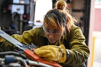 Taos, New Mexico. Wildland firefighters with Taos Field Office, BLM, get ready for wildfires by sharpening and maintaining chainsaws. Photo by Avi Farber, BLM contract photographer. Original public domain image from Flickr