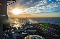 MEDITERRANEAN SEA. The Nimitz-class aircraft carrier USS Dwight D. Eisenhower (CVN 69) transits the Strait of Gibraltar. Original public domain image from Flickr