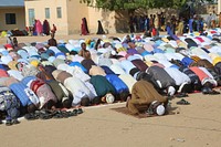 Worshippers pray on Eid al-Adha at Hawo Tako School. AMISOM Photo. Beletweyne, Somalia, July 20, 2021. Original public domain image from Flickr