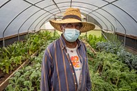 Warren Blue grows a wide variety kale as well as fruit and other vegetables on his farm The Greener Garden Urban Farm LLC, in Baltimore., Md., July 26, 2021. USDA/FPAC Photo by Preston Keres. Original public domain image from Flickr