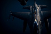 A U.S. Air Force F-16C Fighting Falcon with the 119th Fighter Squadron moves away from a 141st Air Refueling Squadron KC-135R Stratotanker. Original public domain image from Flickr