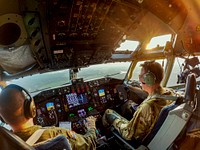 U.S. Air Force Capt. Brandon Johnson, left, and Lt. Col. Martin Ryan fly a KC-135R Stratotanker during a training mission at Joint Base McGuire-Dix-Lakehurst, N.J., July 27, 2021.  (U.S. Air National Guard photo by Master Sgt. Matt Hecht). Original public domain image from Flickr