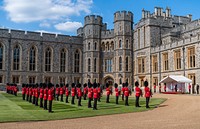 President Joe Biden and First Lady Jill Biden participate in the inspection of the Guard of Honor with Queen Elizabeth II at Windsor Castle, Sunday, June 13, 2021, in Windsor, England. Original public domain image from Flickr