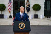 President Joe Biden delivers remarks to essential and frontline workers and military families attending the Fourth of July celebration, Sunday, July 4, 2021, on the South Lawn of the White House. (Official White House Photo by Katie Ricks). Original public domain image from Flickr
