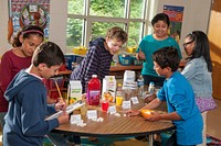Elementary school students examining the amount of added sugars in beverages as part of MyPlate nutrition education. Original public domain image from Flickr