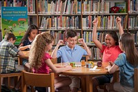 Children participating in a nutrition education activity at a summer meal site in a library. Original public domain image from Flickr