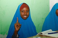 Somalian student smiling. Original public domain image from Flickr