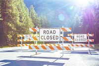 Road closed barricade sign.