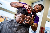 Cops & Barbers provided haircuts to students during a free haircut event at Lakeforest Elementary School October 17, 2022, North Carolina, USA. Original public domain image from Flickr