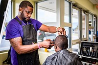 Cops & Barbers provided haircuts to students during a free haircut event at Lakeforest Elementary School October 17, 2022, North Carolina, USA. Original public domain image from Flickr