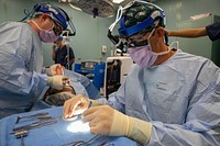 USNS Comfort Medical Teams Perform Surgeries Aboard the Ship 221030-N-YD864-2119PUERTO BARRIOS, Guatemala (Oct. 30, 2022) Cmdr. Michael Eliason, right, cuts cartilage while performing a rhinoscopy aboard the hospital ship USNS Comfort (T-AH 20), Oct. 30, 2022. Comfort is deployed to U.S. 4th Fleet in support of Continuing Promise 2022, a humanitarian assistance and goodwill mission conducting direct medical care, expeditionary veterinary care, and subject matter expert exchanges with five partner nations in the Caribbean, Central and South America. (U.S. Navy photo by Mass Communication Specialist 2nd Class Juel Foster)