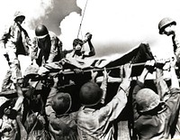 A wounded marine is placed aboard an LVT for evacuation from Tinian, July-August 1944. [World War II][Pacific campaigns]