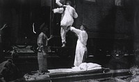 Loading a Hospital Train with typhoid patients, Station 83, Manchuria.