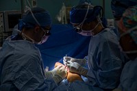 COMFORT PERFORMS SURGERY ON COLOMBIAN CITIZENS IN NEED221113-N-VQ41-1096 CARTAGENA, Colombia (Nov. 13, 2022) Cmdr. Tamara Kemp, right, a plastic surgeon assigned to hospital ship USNS Comfort (T-AH 20), and Cmdr. Gregory Mclean perform a scar-revision surgery on a young Colombian citizen in an operating room aboard Comfort, Nov. 13, 2022. Comfort is deployed to U.S. 4th Fleet in support of Continuing Promise 2022, a humanitarian assistance and goodwill mission conducting direct medical care, expeditionary veterinary care, and subject matter expert exchanges with five partner nations in the Caribbean, Central and South America. (U.S. Navy photo by Mass Communication Specialist 2nd Class Ethan J. Soto)