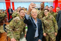 President Joe Biden greets service members of the 82nd Airborne division, Friday, March 25, 2022, at the dining facilities in the G2A Arena in Jasionka, Poland. (Official White House Photo by Adam Schultz)